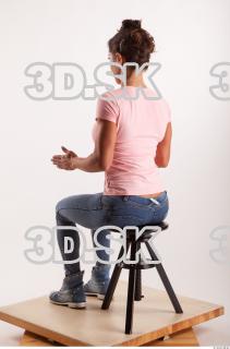 Sitting pose blue jeans pink t shirt of Oxana …